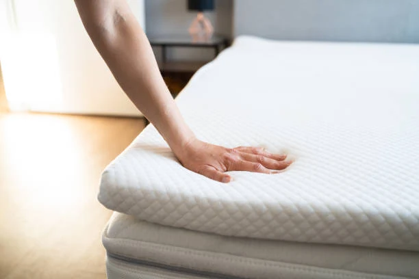 Memory foam topper softness checking by human