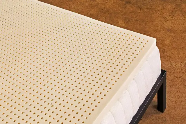 latex mattress topper of pure green company on the mattress close up picture